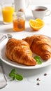 Tasty croissants for breakfast on white plate Royalty Free Stock Photo