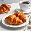 Tasty croissants for breakfast on white plate Royalty Free Stock Photo