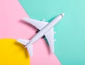 Passenger jet airplane, minimal concept, on funny colors paper with geometric shapes. Royalty Free Stock Photo
