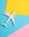 Passenger jet airplane, minimal concept, on funny colors paper with geometric shapes. Royalty Free Stock Photo