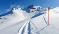 Winter Wonderland: Ski Tracks on Snowy Mountain Slope Royalty Free Stock Photo