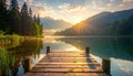 Sunrise over a tranquil lake with a wooden jetty Royalty Free Stock Photo
