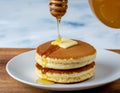 Fluffy Pancakes with Honey and Butter Royalty Free Stock Photo
