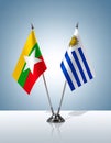 Myanmar and Uruguay flags the relationship with the table, gradient background. Vector Royalty Free Stock Photo