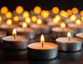 Many candle flames glowing on dark background. Close-up. Free space. Royalty Free Stock Photo