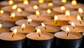 Many candle flames glowing on dark background. Close-up. Free space. Royalty Free Stock Photo