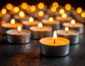 Many candle flames glowing on dark background. Close-up. Free space. Royalty Free Stock Photo
