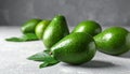 Tasty ripe green avocados on grey background Royalty Free Stock Photo