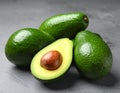 Tasty ripe green avocados on grey background Royalty Free Stock Photo