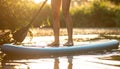 Woman paddle boarding on SUP board in river, closeup Royalty Free Stock Photo