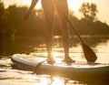 Woman paddle boarding on SUP board in river, closeup Royalty Free Stock Photo