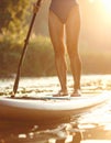 Woman paddle boarding on SUP board in river, closeup Royalty Free Stock Photo