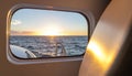 Sunrise Over the Ocean Viewed from a Boat Porthole Royalty Free Stock Photo