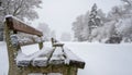 Lonely Park Bench in a Snowy Winter Landscape Royalty Free Stock Photo