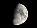 The moon over dark black sky at night Royalty Free Stock Photo