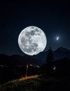 The moon over dark black sky at night Royalty Free Stock Photo