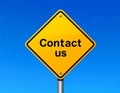 Contact Us Sign on Blue Sky Royalty Free Stock Photo