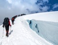 Mountaineers Ascending Snowy Ridge Royalty Free Stock Photo