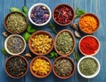 Many different herbs in bowls on blue wooden table Royalty Free Stock Photo