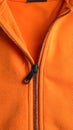 Orange sweatshirt with zipper as background, closeup view Royalty Free Stock Photo