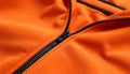 Orange sweatshirt with zipper as background, closeup view Royalty Free Stock Photo