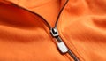 Orange sweatshirt with zipper as background, closeup view Royalty Free Stock Photo