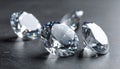 Beautiful shiny diamonds on dark gray table, closeup Royalty Free Stock Photo