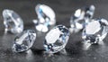 Beautiful shiny diamonds on dark gray table, closeup Royalty Free Stock Photo