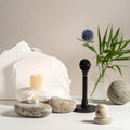 ASMR podcast microphone in a zen setting with natural stones, candles, and a blue flower for calm audio recording. Royalty Free Stock Photo