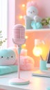 Pink microphone on a kawaii pastel desk for podcasting or streaming. Cute aesthetic vlogger setup with soft focus backgr Royalty Free Stock Photo