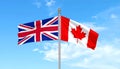 Great Britain and Canada, two flags waving against blue sky. 3d image Royalty Free Stock Photo