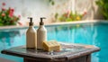 Two bottles of shampoo and handmade soap on old small vintage painted table near Royalty Free Stock Photo