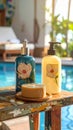 Two bottles of shampoo and handmade soap on old small vintage painted table near Royalty Free Stock Photo