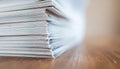 Stack of Paper on Wooden Surface Royalty Free Stock Photo