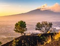 Mount Etna Volcano with smoke at dawn and the Catania city, Sicily island, Italy, Europa Royalty Free Stock Photo