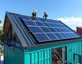 Solar panel installation on a modern container home Royalty Free Stock Photo