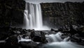 Dramatic Waterfall Over Dark Rocks Royalty Free Stock Photo