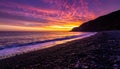 Dramatic Coastal Sunset with Vibrant Sky and Pebble Beach Royalty Free Stock Photo