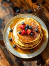 Delicious Stack of Pancakes with Berries and Syrup Royalty Free Stock Photo