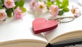 Red wooden heart pendant, an open diary with clean pages and flowers. Romantic concept Royalty Free Stock Photo