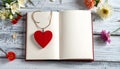 Red wooden heart pendant, an open diary with clean pages and flowers. Romantic concept Royalty Free Stock Photo