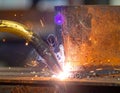 Welding metal with sparks in a factory. Industrial steel fabrication and construction close-up. Royalty Free Stock Photo