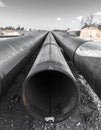 Pipeline construction with large industrial steel pipes. Oil, gas, or water main infrastructure project. Royalty Free Stock Photo