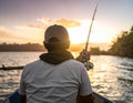 Fisherman on the boat, sunset,Rear View Royalty Free Stock Photo
