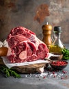 Raw meat on the kitchen table on a metallic background in a composition with cooking Royalty Free Stock Photo