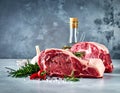 Raw meat on the kitchen table on a metallic background in a composition with cooking Royalty Free Stock Photo