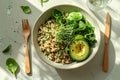 Healthy quinoa bowl with avocado, spinach, and microgreens in bright natural sunlight on a rustic table â AI-Generated Royalty Free Stock Photo