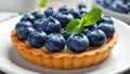 Delicious blueberry tart on plate, closeup Royalty Free Stock Photo