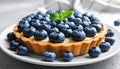 Delicious blueberry tart on plate, closeup Royalty Free Stock Photo