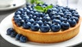 Delicious blueberry tart on plate, closeup Royalty Free Stock Photo